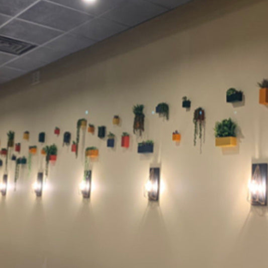Wall with decorative items and lights in a room setting